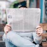 Picture of a man reading the news
