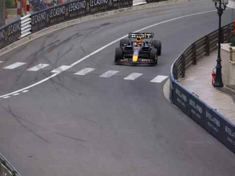 Formula 1 race car speeding on the track in Monaco. - Leadership at 200 MPH: F1's High-Octane Lessons for the C-Suite