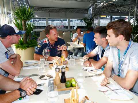 A corporate leader morphing into an F1 team principal, representing the strategic role of a Chief Product Officer.