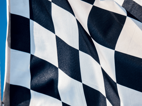 F1 race infused with executive recruitment symbolizing Alder Koten's approach to CPO recruitment