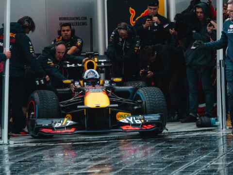 Image of a high-speed F1 car representing the dynamic race for top-tier talent in the tech industry.