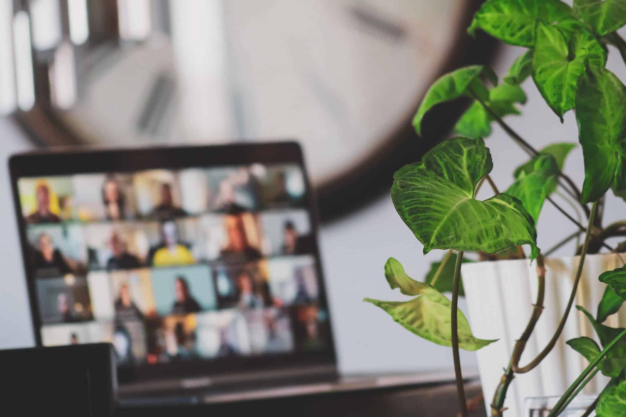 A Head of Remote Work directing a virtual meeting with remote employees, replicating the role of a team principal in a Formula 1 race.