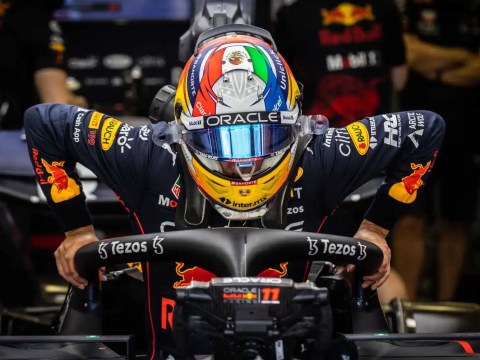 An F1 racer merged with a sales leadership strategy session, representing the synergy of speed, strategy, and guidance.