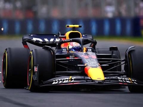 Formula 1 car mastering a sharp turn, mirroring the agility needed in today's dynamic corporate world.