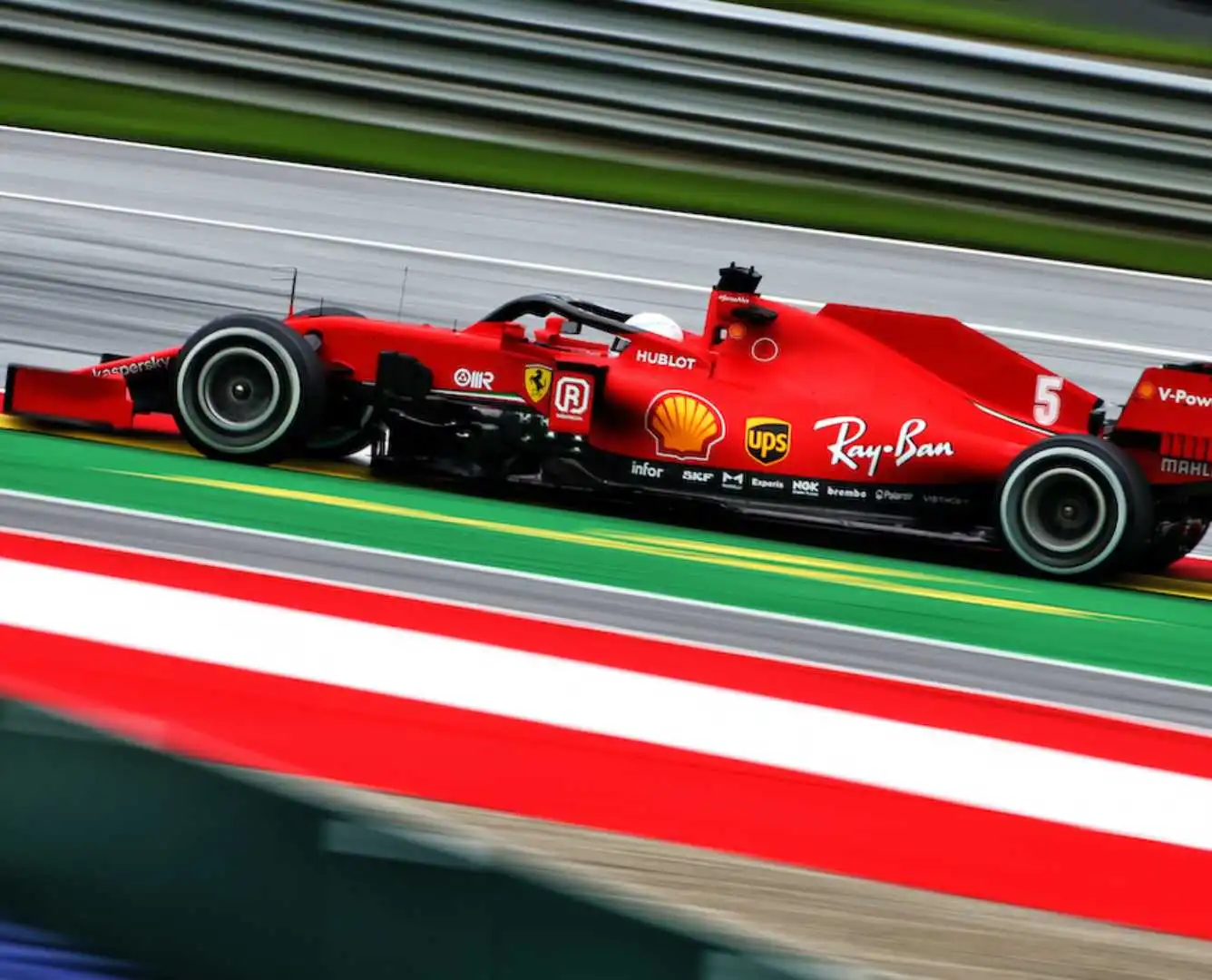 Formula 1 car racing on the track representing swift and strategic innovation in business.