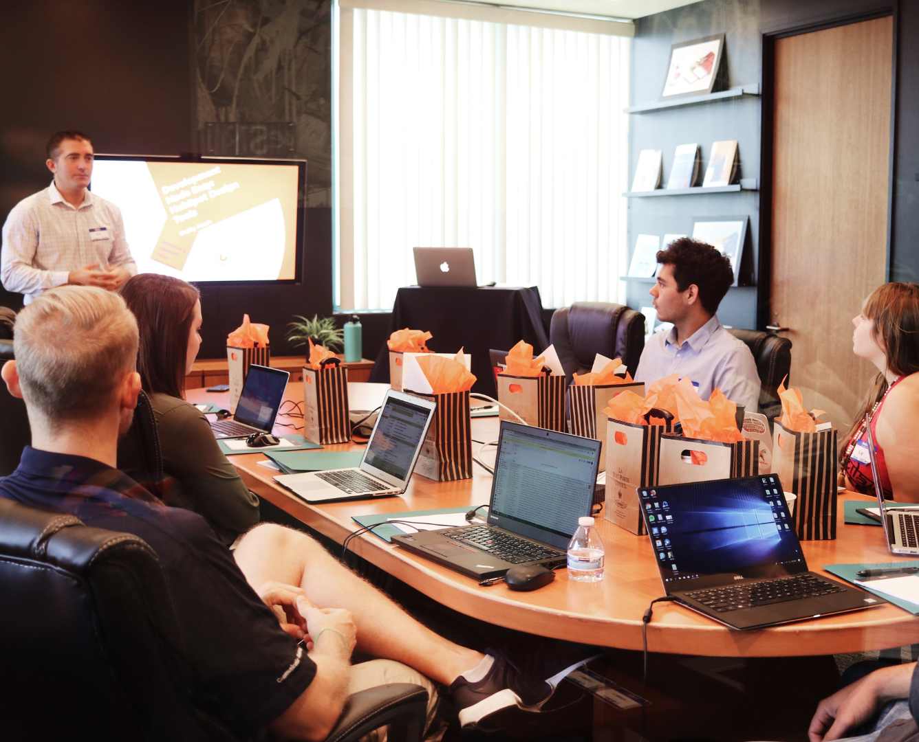Group of diverse executive strategizing in a Mexico City boardroom, symbolizing the role of executive search firms in Mexican economic growth.