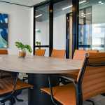 Diverse group of professionals in a boardroom, symbolizing the role of Non-Executive Directors in corporate governance.