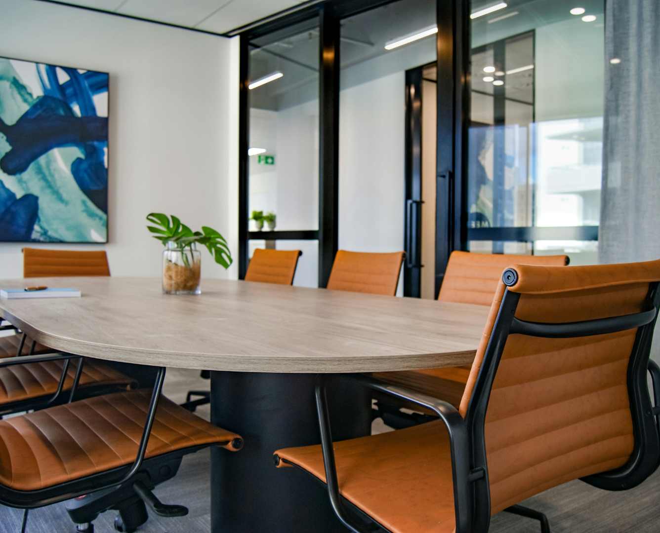Diverse professionals gathered in a boardroom discussion.