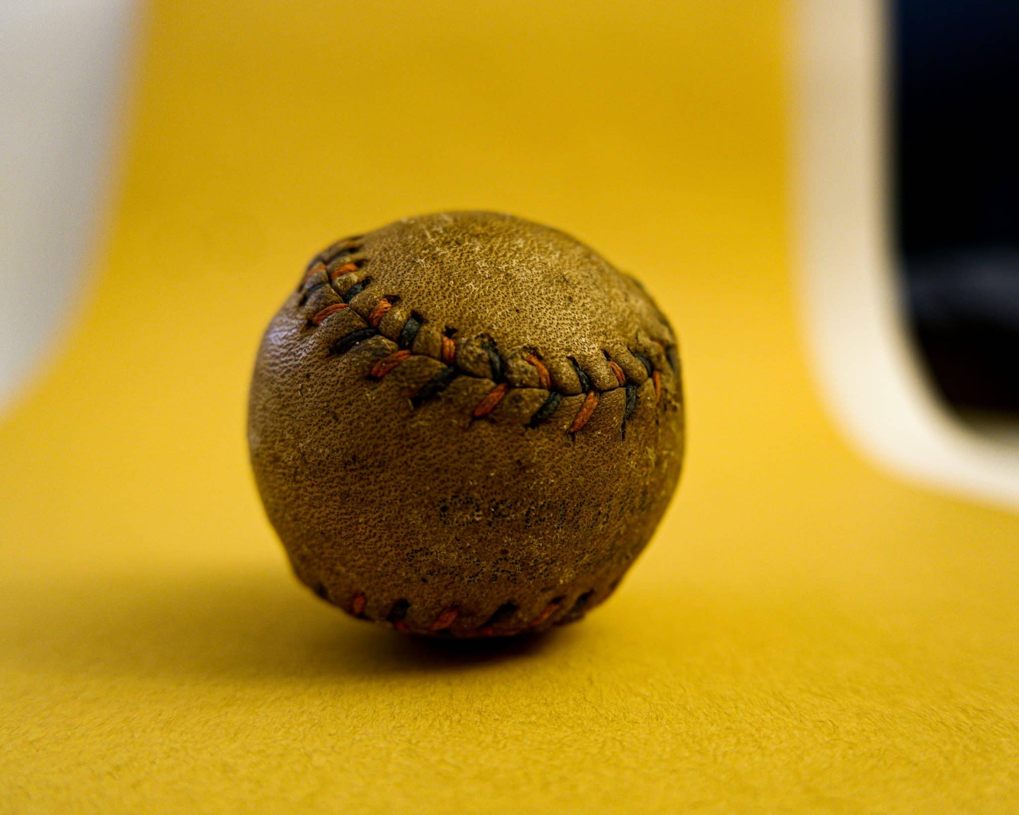 Close-up of a baseball on the field, symbolizing team depth and strategic planning in sales leadership.
