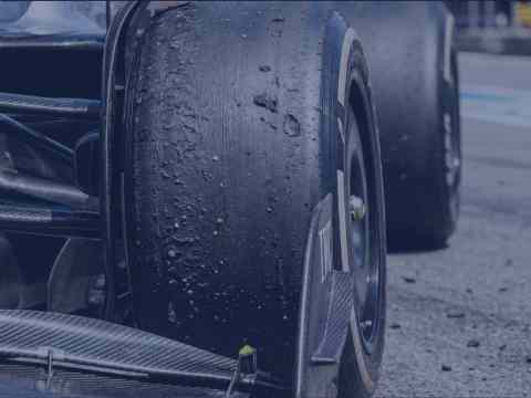 Worn Formula 1 tire showing heat degradation representing executive compound mismatch during startup scaling from Series A to Series C