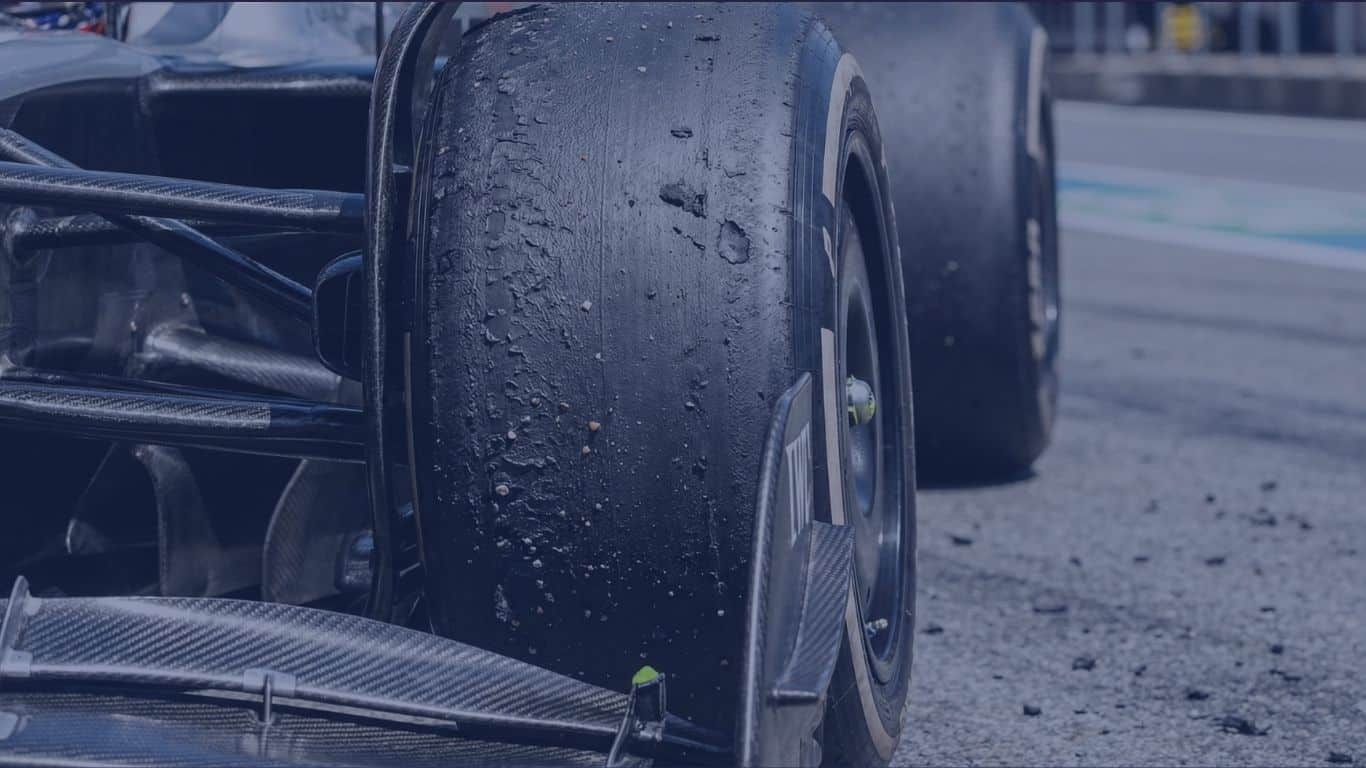 Worn Formula 1 tire showing heat degradation representing executive compound mismatch during startup scaling from Series A to Series C