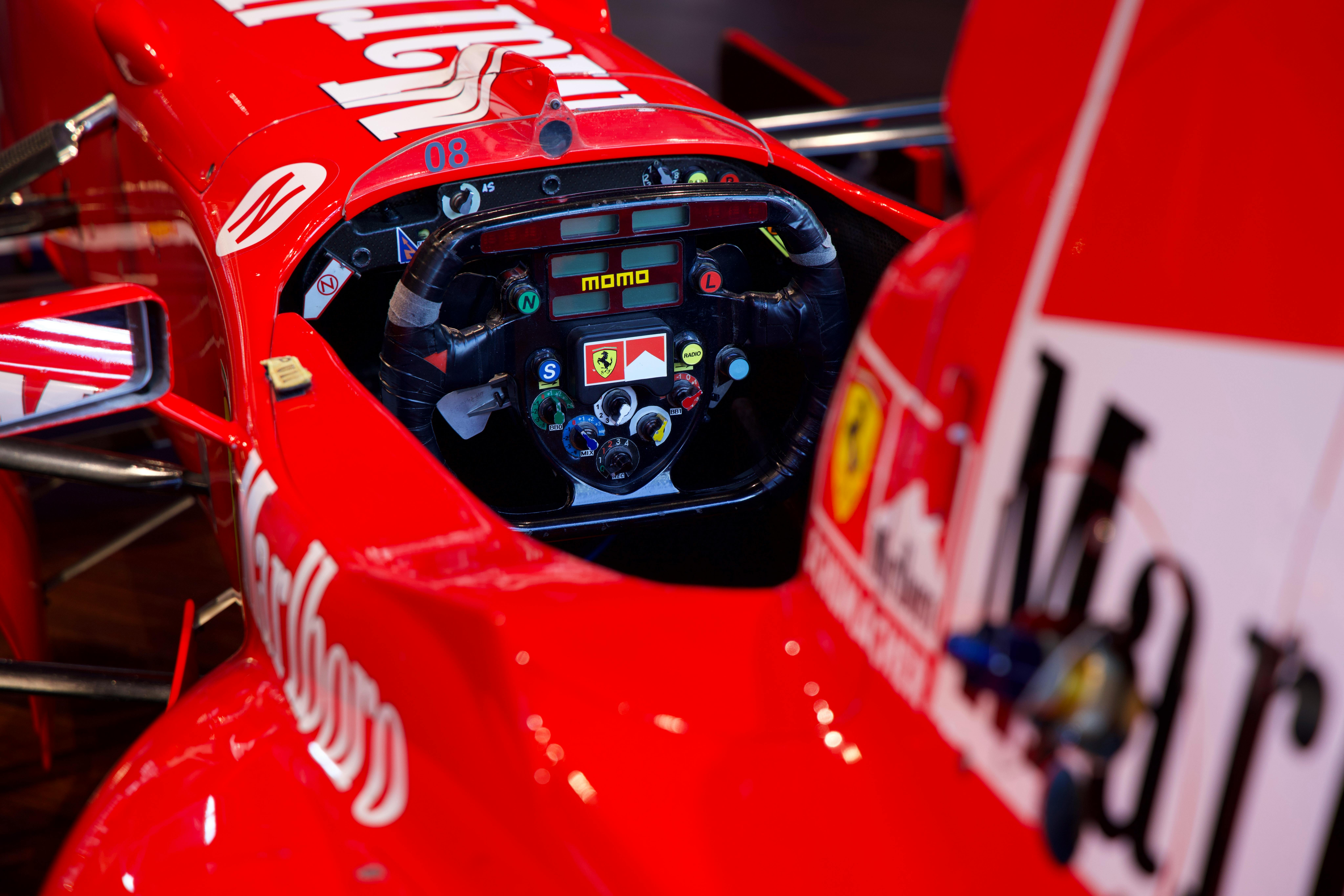 F1 driver cockpit view showing calibration instruments and telemetry representing The Driver Calibration framework for executive assessment