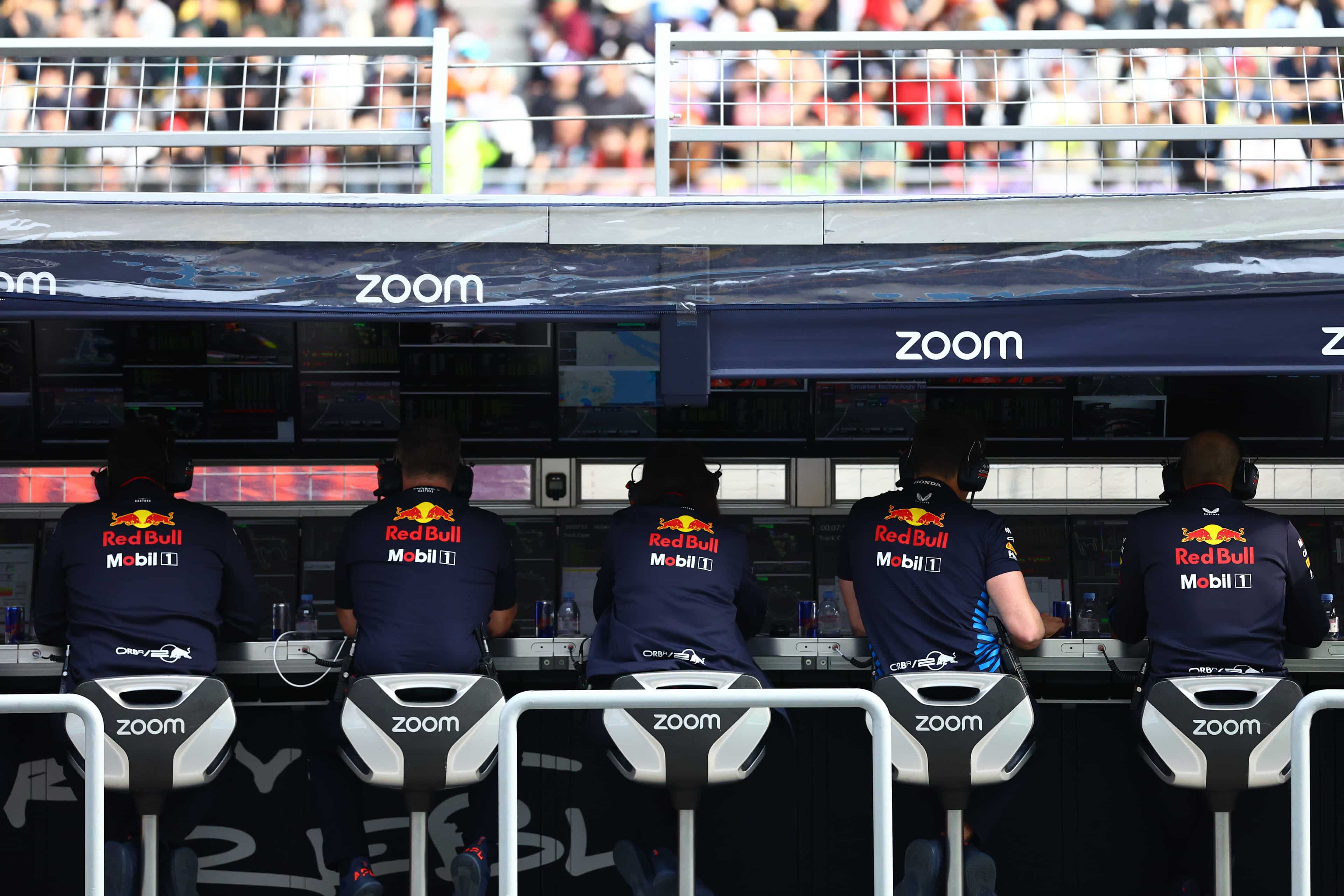 F1 pit wall telemetry screens displaying race conditions data representing the diagnostic framework for leadership decisions