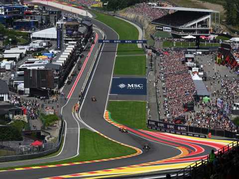 F1 race car positioning at track limits during corner, demonstrating clear boundaries enabling maximum performance