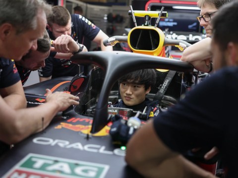 Race driver stationary in pit lane while competitors pass on track, representing the cost of accepting a counter-offer while career momentum moves on