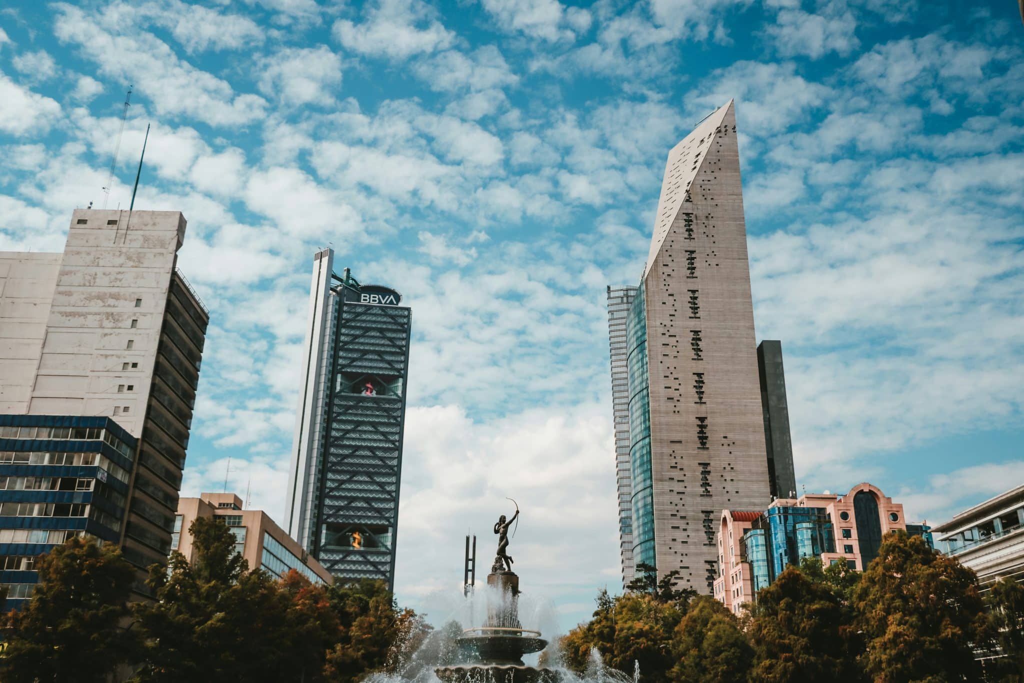 Mexico City Reforma business district skyline at golden hour showing major corporate towers