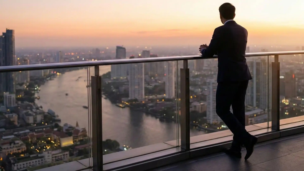 Founder contemplating next chapter while overlooking city skyline at dawn