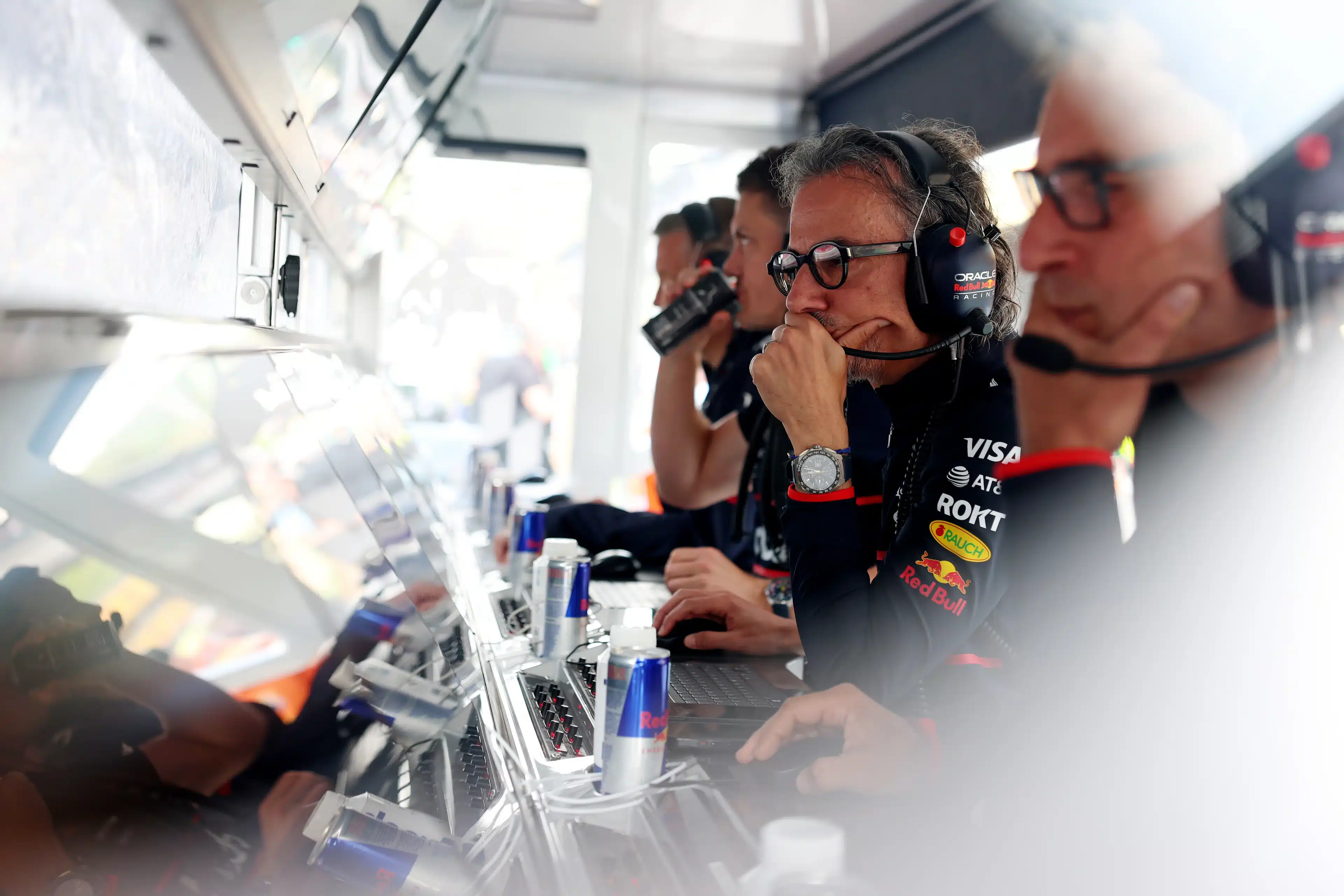 F1 pit wall during a race, representing the organizational support structures executives rely on for critical decisions