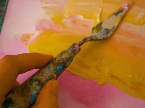 Founder painting over a CMO's finished brand strategy illustrating founder brand attachment conflict