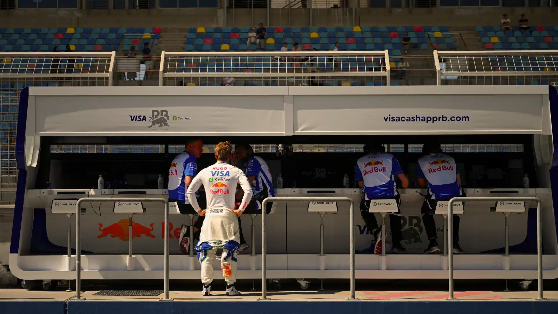 Disconnected F1 pit wall monitors illustrating fragmented revenue leadership without unified authority
