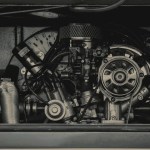 Split turbocharger components on a workbench, symbolizing fintech leadership compliance design