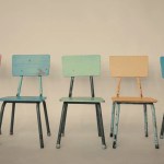 Five identical chairs arranged symmetrically around a table, representing search committee bias toward sameness