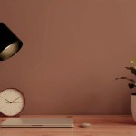 Silent desk phone on a busy-looking desk, representing the shift from AI and executive judgment to direction over execution